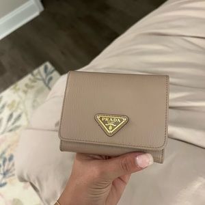 Prada wallet. Beautiful condition. Color is a light pink/beige. Authentic wallet